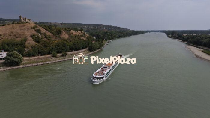 The River Cruise Ship Amadeus Cara Sails on the Danube - 4K Drone video