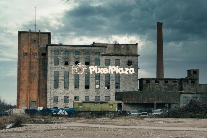 Abandoned Chemical Plant with Broken Windows and Smokestack Abandoned Chemical Plant with Broken Windows and Smokestack
