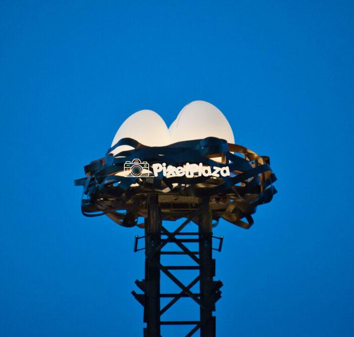 Illuminated Artistic Nest with Glowing Egg Sculptures