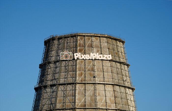 Industrial Cooling Tower Against a Clear Blue Sky Industrial Cooling Tower Against a Clear Blue Sky
