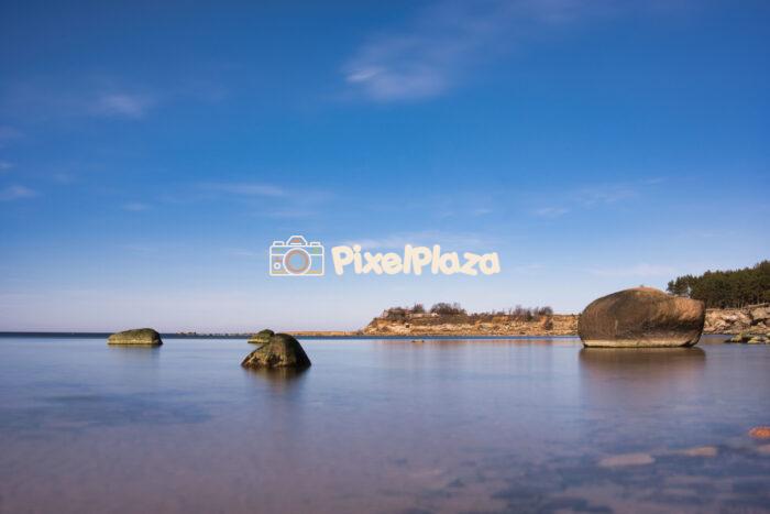 Tranquil Baltic Seascape with Coastal Boulders