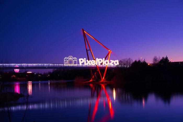 Modern Pedestrian Bridge Illuminated at Dusk Modern Pedestrian Bridge Illuminated at Dusk