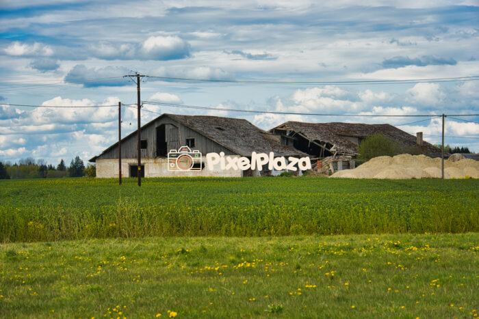 Abandoned Farmhouse in Green Countryside Under Cloudy Sky Abandoned Farmhouse in Green Countryside Under Cloudy Sky