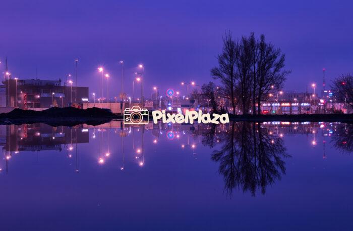 City Lights Reflected in Water at Twilight