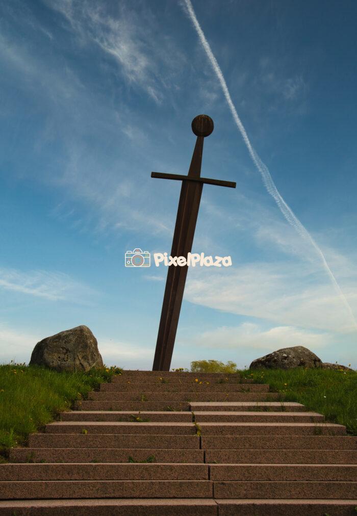 Epic Sword Monument Against Blue Sky – Symbol of Heritage and Valor Epic Sword Monument Against Blue Sky – Symbol of Heritage and Valor