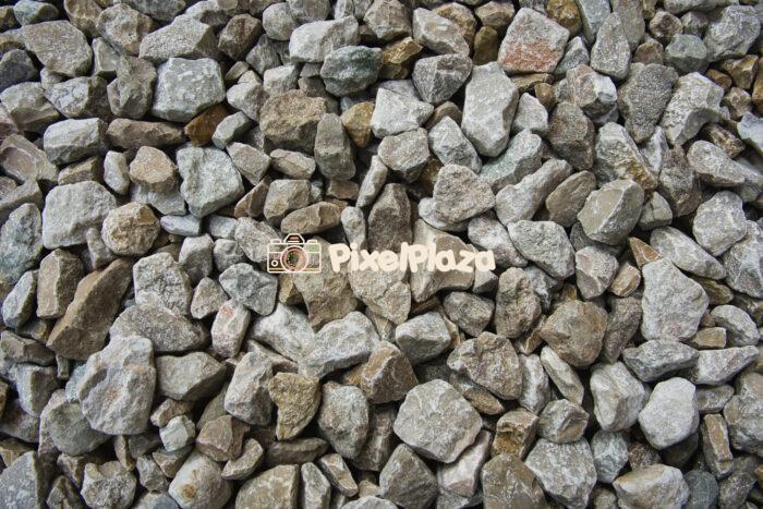 Pile of Rough Natural Stones and Gravel Background
