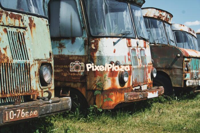 A row of abandoned and rusty Soviet-era trucks A row of abandoned and rusty Soviet-era trucks