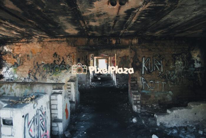 Abandoned Graffiti-Covered Building Corridor Abandoned Graffiti-Covered Building Corridor