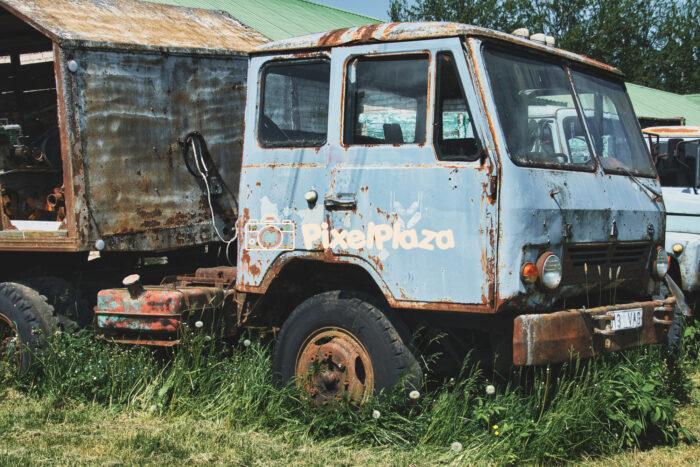 Abandoned Rusty Old Soviet-era Truck KAZ-608 in Overgrown Grass