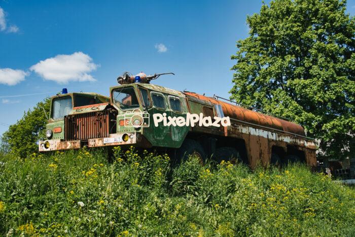 Abandoned Soviet-Era Military Fuel Truck in Overgrown Field