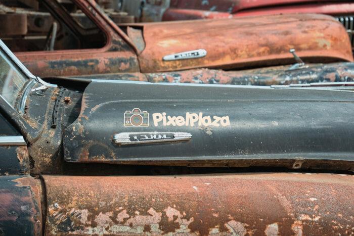Close-Up of Rusting Classic Cars in a Junkyard