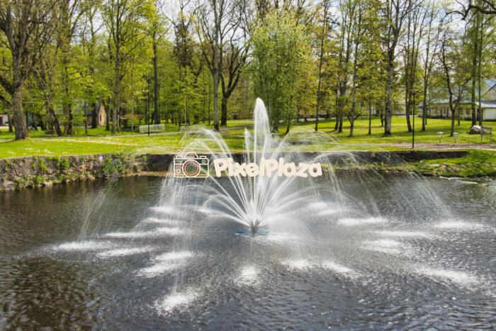 Elegant Water Fountain in a Lush Green Park During Spring Elegant Water Fountain in a Lush Green Park During Spring