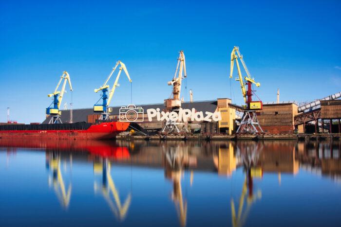 Industrial Cranes and Cargo Ship at Ventspils Port, Latvia