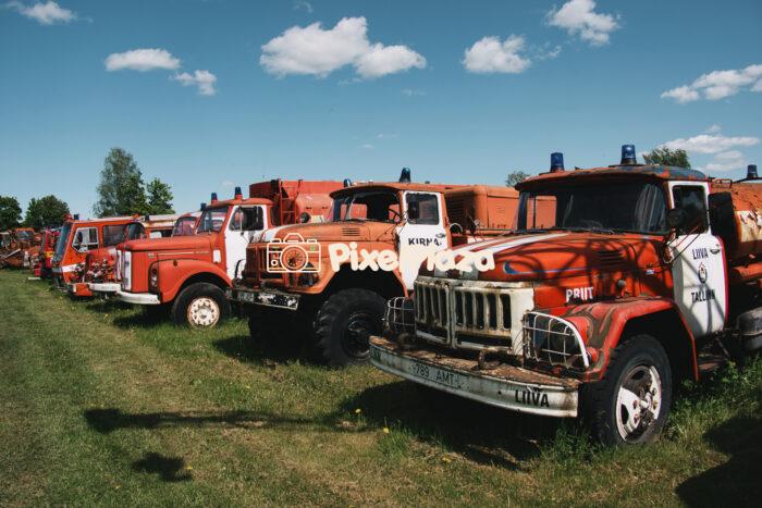 Line of Vintage Fire Trucks in Rural Estonia Line of Vintage Fire Trucks in Rural Estonia