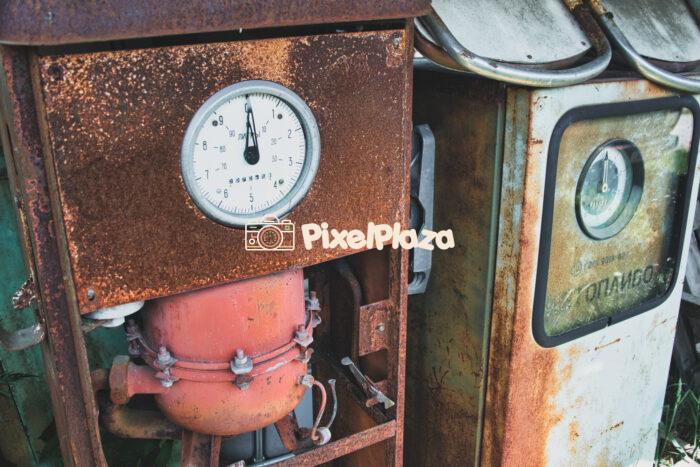 Rusty Soviet-Era Gas Pumps – Vintage Fuel Dispensers with Cyrillic Dials Rusty Soviet-Era Gas Pumps - Vintage Fuel Dispensers with Cyrillic Dials