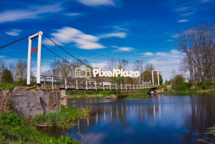 Suspension Footbridge Over the Põltsamaa River on a Clear Spring Day