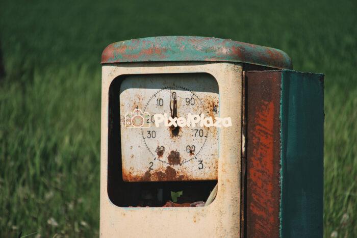 Vintage Rusty Gas Pump in a Field Vintage Rusty Gas Pump in a Field