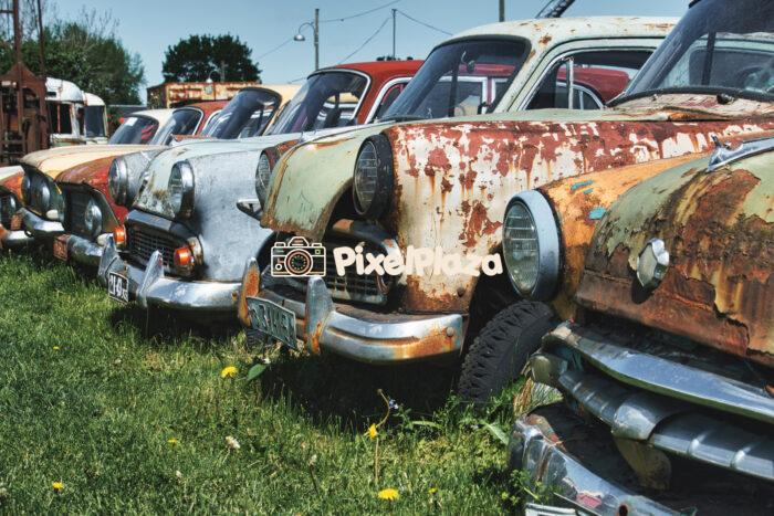 A row of rusty old Moskvichs - Retro Automotive Decay