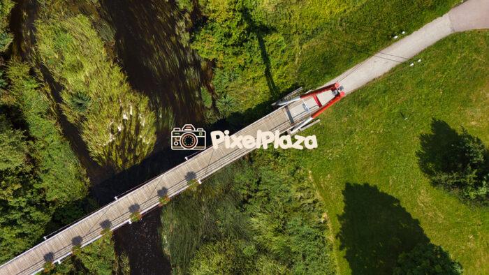 Aerial View of Kohila Pedestrian Bridge Over Keila River - Estonia Aerial View of Kohila Pedestrian Bridge Over Keila River - Estonia