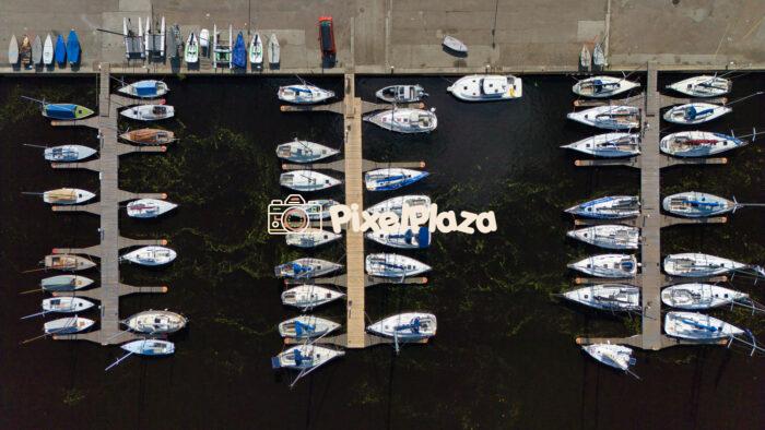 Aerial View of Sailboats Moored at Marina - Nautical Harbor from Above