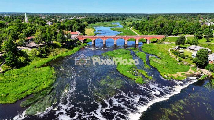 Drone Video of Kuldīga, Latvia - Aerial Tour of the Historic Red Brick Bridge and Venta River
