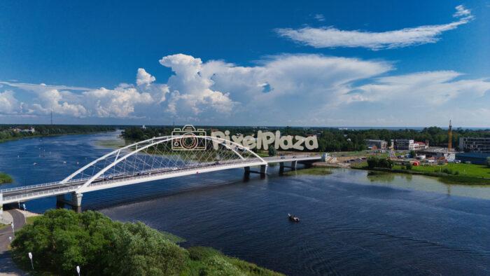 Modern White Bridge Over Pärnu River - Scenic Summer Drone View, Estonia Modern White Bridge Over Pärnu River - Scenic Summer Drone View, Estonia