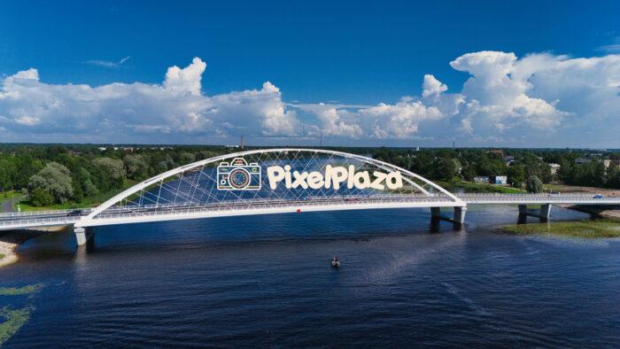 Modern White Rääma Arch Bridge Over Pärnu River - Aerial View, Estonia