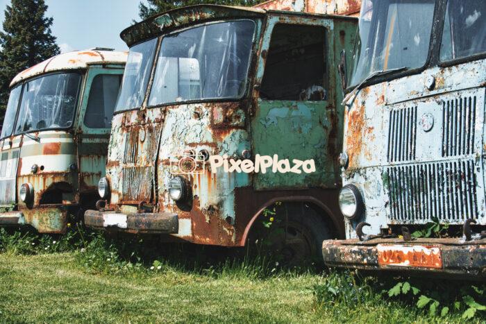 Rusting Soviet-Era Trucks in Abandoned Field - Vintage Industrial Decay Rusting Soviet-Era Trucks in Abandoned Field - Vintage Industrial Decay