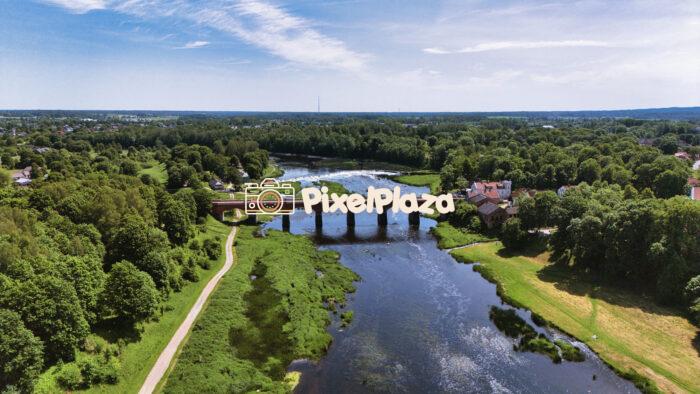 Scenic Drone View of Kuldīga, Latvia - Historic Bridge Over the Venta River in Summer
