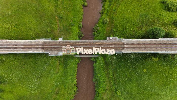 Top-Down Aerial View of Railway Bridge Over Rauna River, Latvia