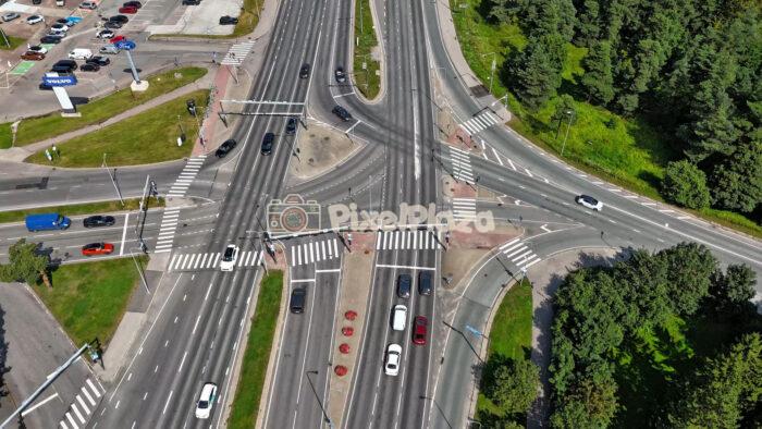 Aerial Hyperlapse of Busy Urban Intersection in Tallinn Järve, Estonia - Summer Traffic Flow