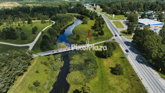 Drone View of Pedestrian Bridge Over Keila River in Kohila, Estonia - Summer Landscape