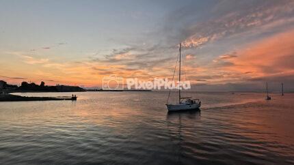 Sailboat at Sunset in Tallinn, Estonia - Scenic Evening on the Baltic Sea