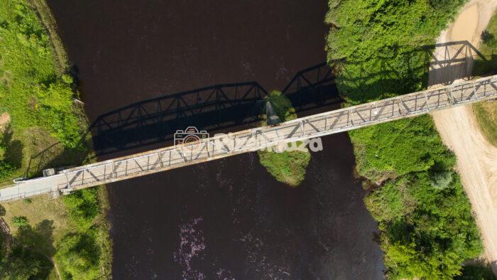 Top-Down Drone View of Valmiera Iron Bridge Crossing Gauja River, Latvia Top-Down Drone View of Valmiera Iron Bridge Crossing Gauja River, Latvia
