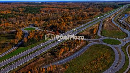 Aerial Hyperlapse of Estonian Highway in Autumn Colors - Scenic Drone View