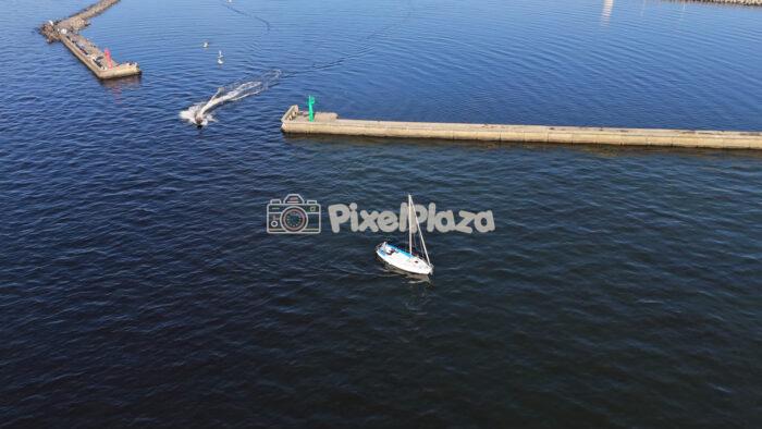 Aerial View of Sailboat and Jet Ski at Pirita Harbour - Tallinn, Estonia