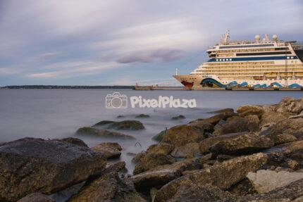 Cruise Ship Docked at Tallinn Harbor with Long Exposure Water and Rocky Shore