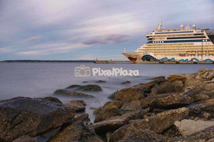 Cruise Ship Docked at Tallinn Harbor with Long Exposure Water and Rocky Shore