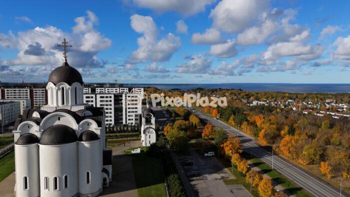 Autumn Aerial View of Tallinn with Church and Coastline - 4K Drone Video