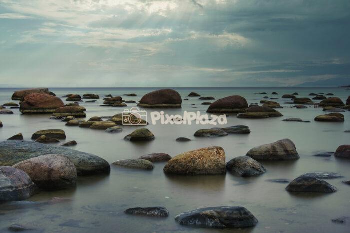 Glacial Erratic Boulders on Viimsi Coastline at Sunset Glacial Erratic Boulders on Viimsi Coastline at Sunset