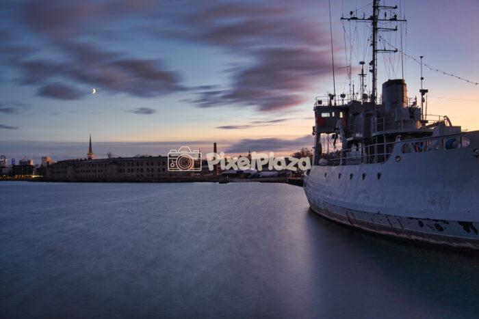 Historic Ship Docked at Tallinn Harbor near Patarei Sea Fortress at Twilight