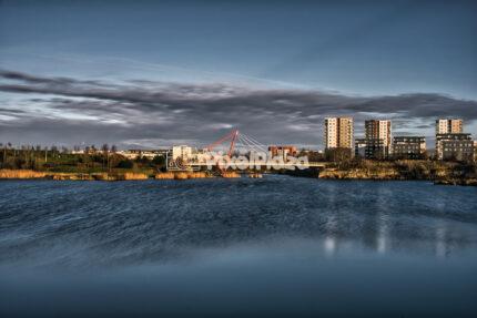 Red Suspension Bridge Over Pae Lake at Sunset with Long Exposure Water Effect