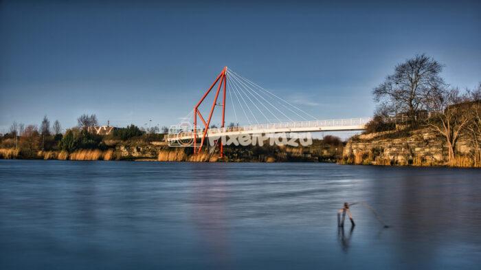 Red Suspension Pedestrian Bridge Over Pae Lake Long Exposure