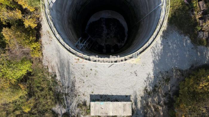 Top-Down Drone View of Industrial Water Tower with Flowing Water, Paljassaare - 4K Drone Video