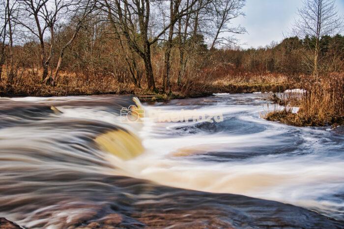 Dynamic Long Exposure of Vahiküla Waterfall Cascading Through Estonian Forest Dynamic Long Exposure of Vahiküla Waterfall Cascading Through Estonian Forest