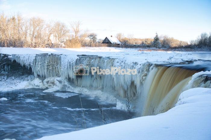Majestic Frozen Jägala Waterfall in Estonian Winter Landscape