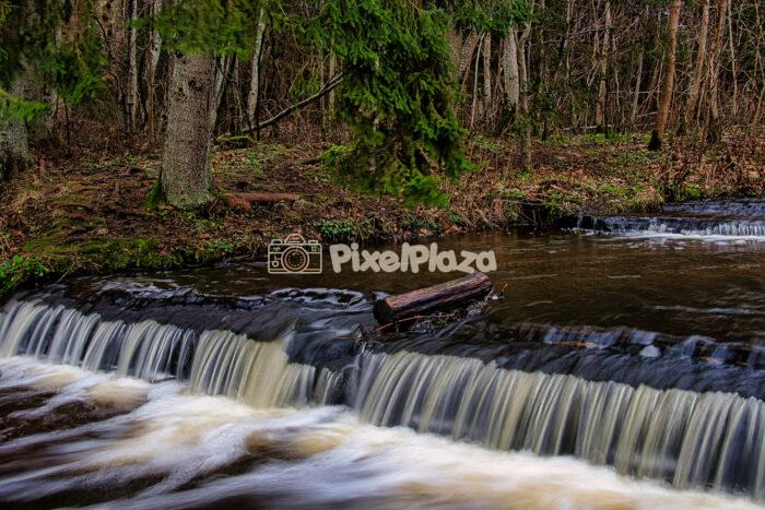 Single Cascade with Fallen Log at Treppoja Waterfall, Estonia Single Cascade with Fallen Log at Treppoja Waterfall, Estonia