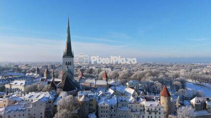Tallinn Old Town in Winter - Snowy Medieval Skyline Aerial View 4K Drone Video