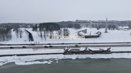 Winter Aerial View of Pirita Road and Coastal Memorial, Tallinn, Estonia - 4K Drone Video