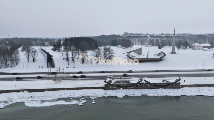 Winter Aerial View of Pirita Road and Coastal Memorial, Tallinn, Estonia - 4K Drone Video